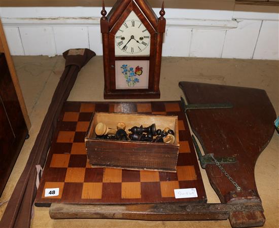 Rudder, chess set, fishing rod and a clock